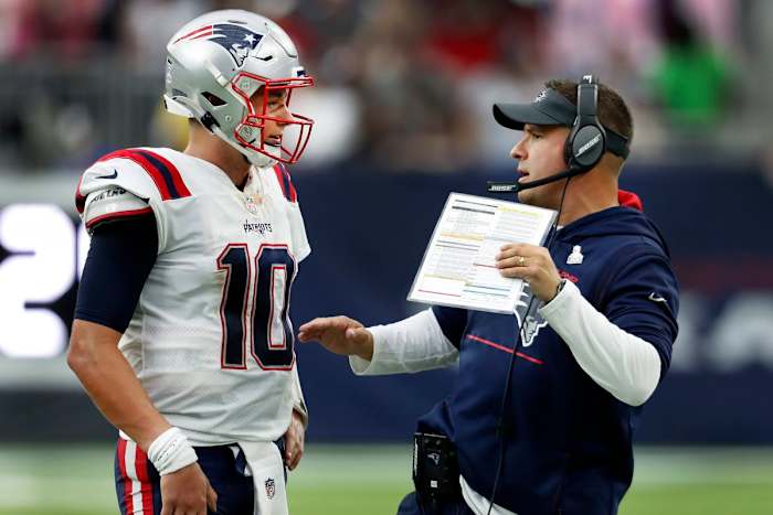 Josh McDaniels in happier times, coaching up Pro Bowl rookie Mac Jones.